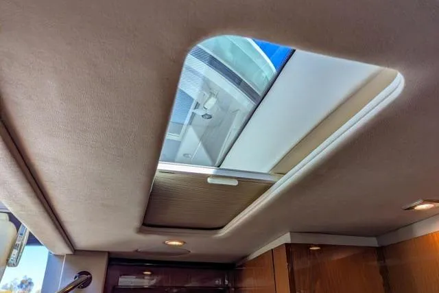 Nautalia Yacht Photos Pics Interior view of 2013 Sea Ray 470 Sundancer yacht with skylight.