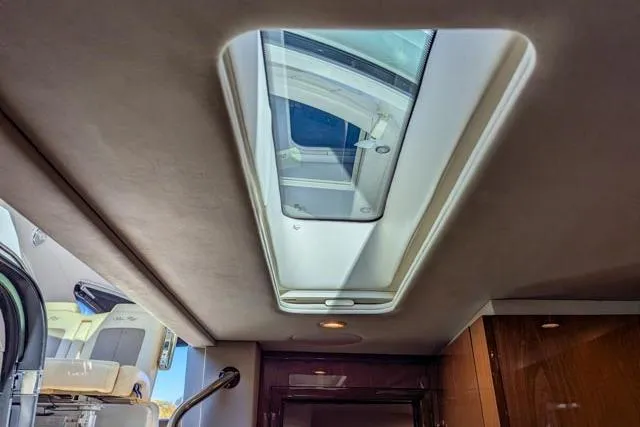 Nautalia Yacht Photos Pics Interior view of 2013 Sea Ray 470 Sundancer yacht with skylight.