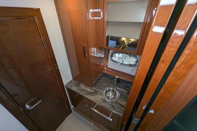Nautalia Yacht Photos Pics Luxurious 2013 Sea Ray 470 Sundancer bathroom with wood cabinetry and sleek sink.
