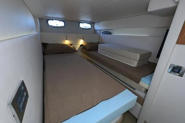 Nautalia Yacht Photos Pics 2013 Sea Ray 470 Sundancer cabin with twin beds and modern lighting.