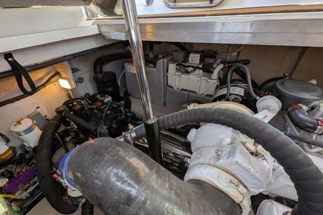 Nautalia Yacht Photos Pics Engine room of 2013 Sea Ray 470 Sundancer, showcasing mechanical components and systems.