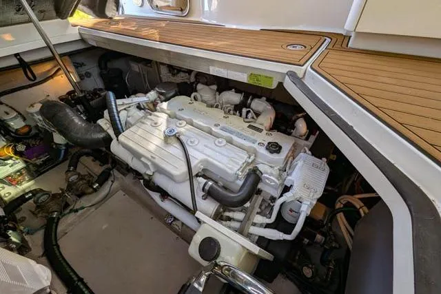 Nautalia Yacht Photos Pics Engine compartment of a 2013 Sea Ray 470 Sundancer boat, showcasing detailed mechanical components.