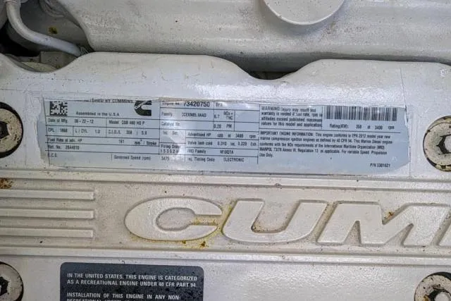 Nautalia Yacht Photos Pics Engine label on a 2013 Sea Ray 470 Sundancer, featuring Cummins branding and specifications.