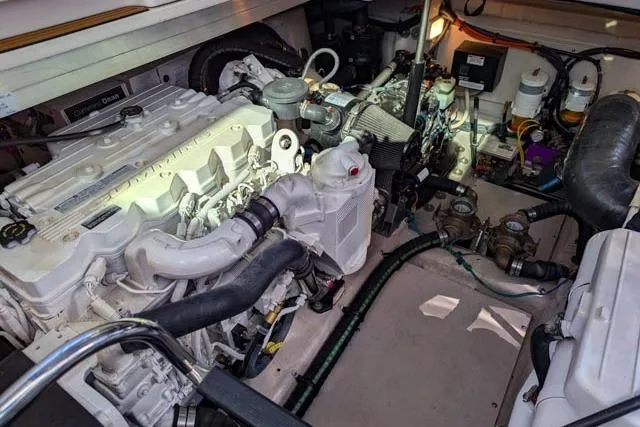 Nautalia Yacht Photos Pics Engine room of 2013 Sea Ray 470 Sundancer, showcasing mechanical components and systems.