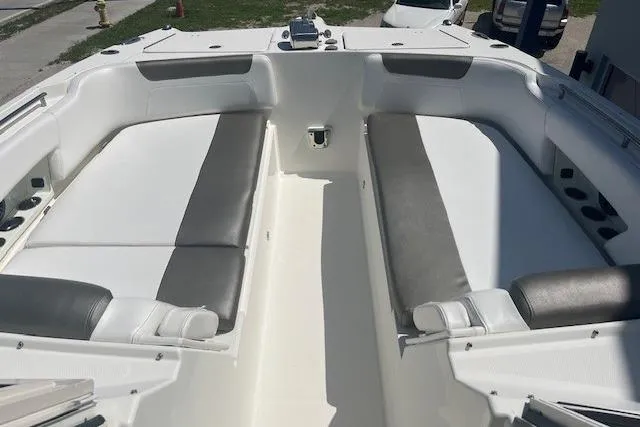  Yacht Photos Pics 2018 World Cat 320 DC boat interior with white and gray seating, spacious layout.