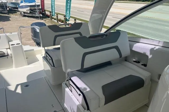 Yacht Photos Pics 2018 World Cat 320 DC boat interior with cushioned seating and modern design.