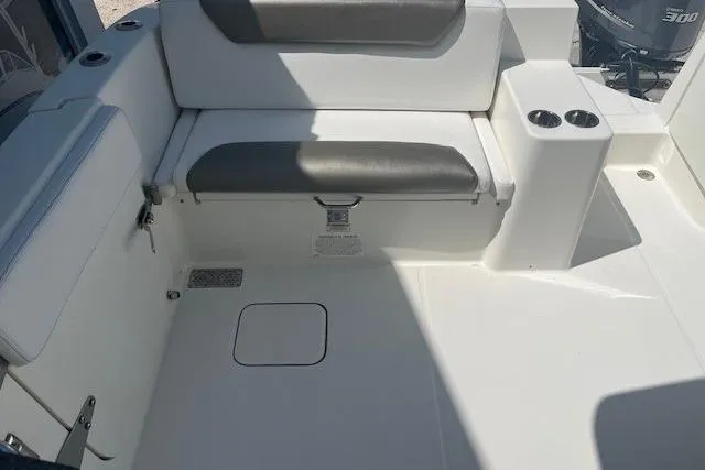  Yacht Photos Pics 2018 World Cat 320 DC boat interior with seating and cup holders.