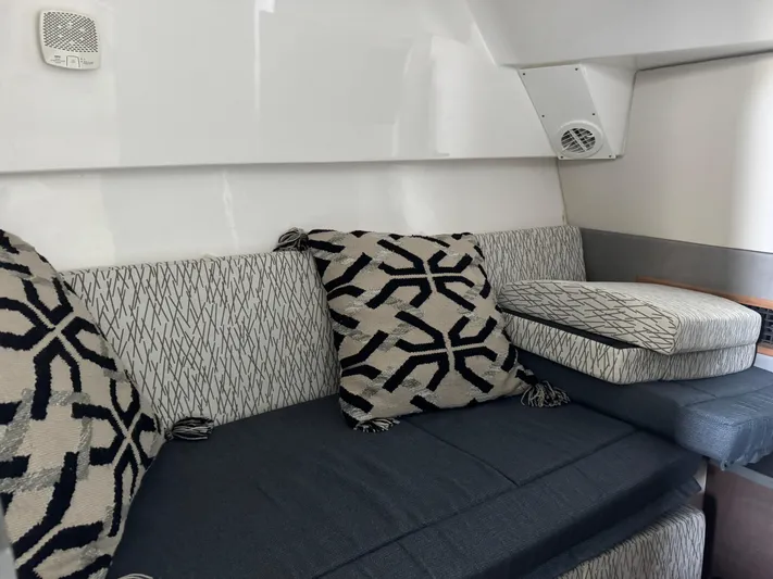  Yacht Photos Pics Interior of 2019 Everglades 340 Dual Console with patterned cushions and seating.