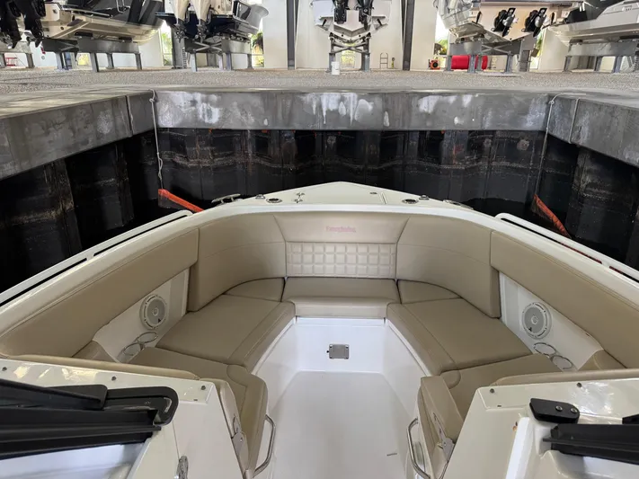  Yacht Photos Pics 2019 Everglades 340 Dual Console boat interior with beige seating in storage facility.