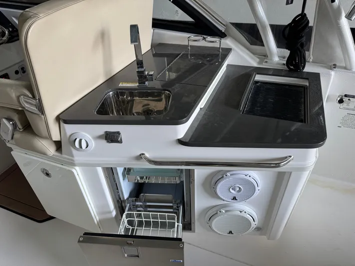  Yacht Photos Pics 2019 Everglades 340 Dual Console boat interior with sink, grill, and storage.