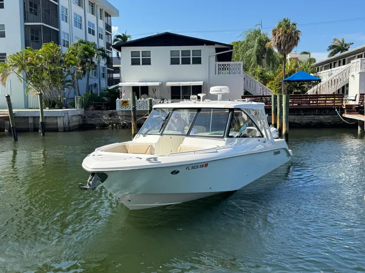 Yacht Photos Pics 2019 Everglades 340 Dual Console boat docked near waterfront homes.