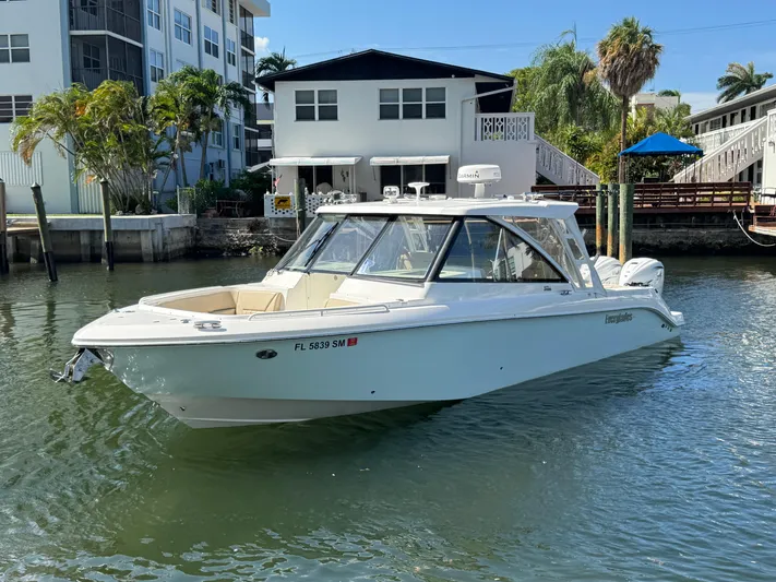  Yacht Photos Pics 2019 Everglades 340 Dual Console boat docked near waterfront homes.
