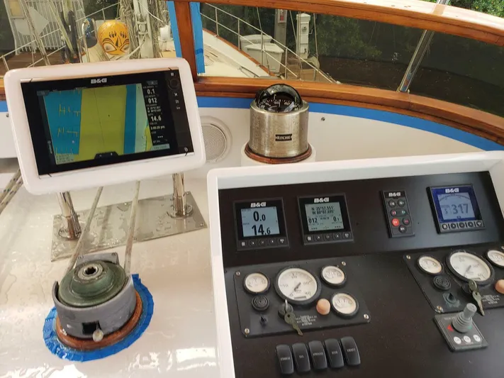 Maraya Yacht Photos Pics Cockpit of 1990 Cheoy Lee Sloop with navigation instruments and controls.