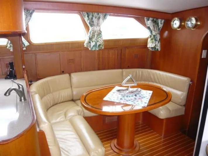 Maraya Yacht Photos Pics Luxurious 1990 Cheoy Lee Sloop interior with leather seating and elegant wood finishes.