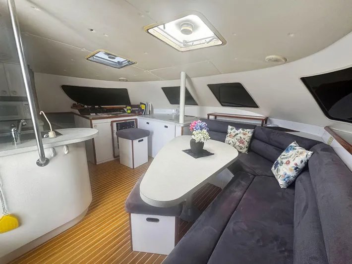Kisa Yacht Photos Pics Interior of 2000 Manta 42 yacht with modern kitchen and cozy seating area.