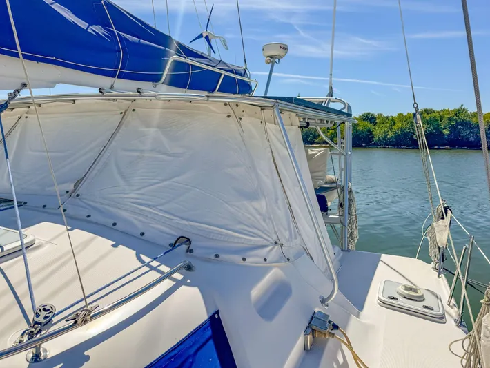 Kisa Yacht Photos Pics Sailing yacht Manta 42, 2000 model, on calm waters under clear blue skies.