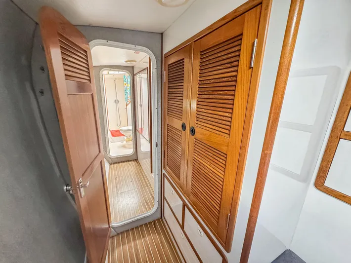 Kisa Yacht Photos Pics Interior hallway of a 2000 Manta 42 yacht with wooden doors and flooring.
