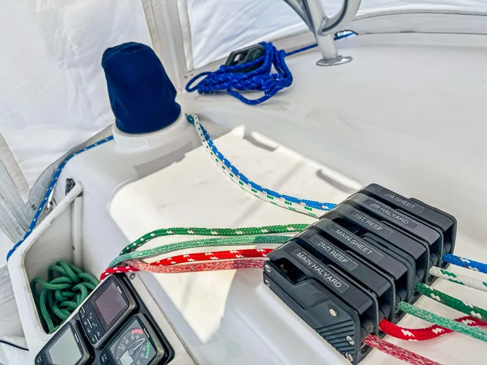 Kisa Yacht Photos Pics Sailing equipment on a 2000 Manta 42 catamaran with colorful ropes and control panels.