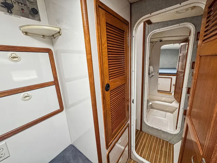 Kisa Yacht Photos Pics Interior of 2000 Manta 42 sailboat with wooden cabinetry and compact design.