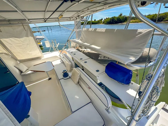 Kisa Yacht Photos Pics Spacious deck of 2000 Manta 42 catamaran with seating and scenic water view.