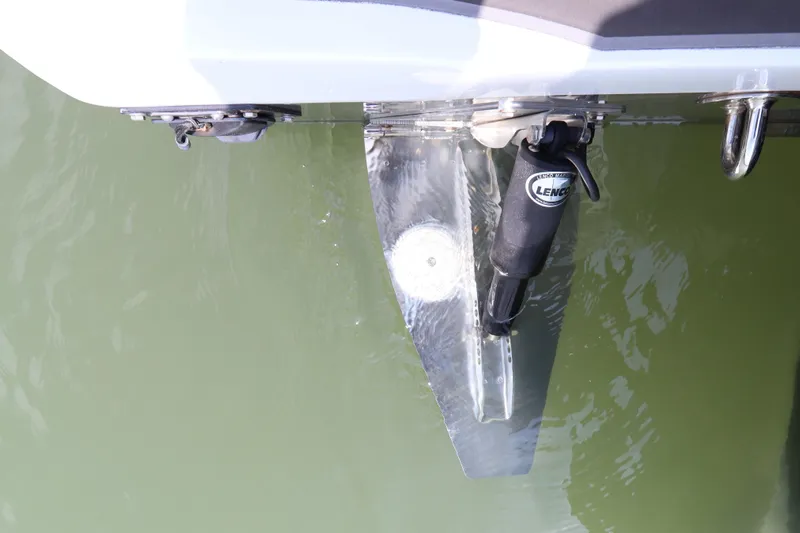  Yacht Photos Pics Trim tab of a 2019 Statement 350 Open boat in water.