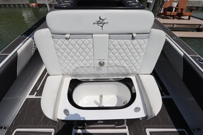  Yacht Photos Pics 2019 Statement 350 Open boat with white quilted seating and built-in storage compartment.