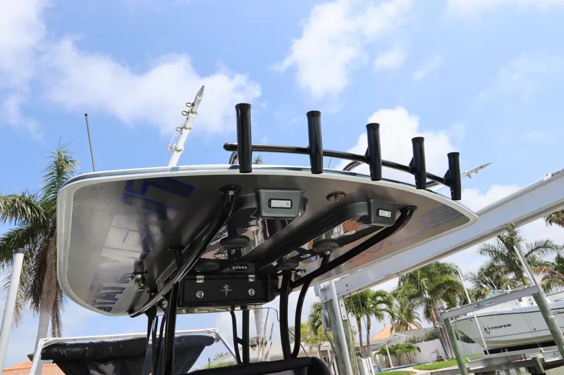  Yacht Photos Pics 2019 Statement 350 Open boat with rod holders and electronics under a clear sky.