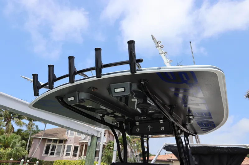  Yacht Photos Pics 2019 Statement 350 Open boat with rod holders and electronics under a blue sky.
