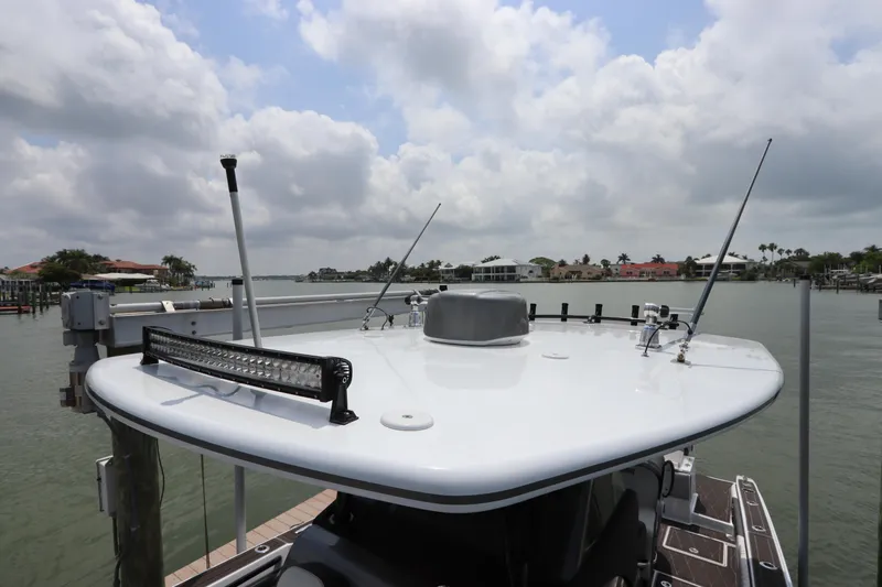  Yacht Photos Pics Statement 350 Open 2019 boat docked with a view of the water and cloudy sky.