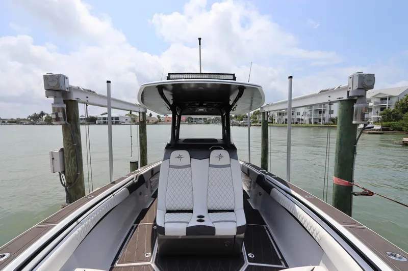  Yacht Photos Pics 2019 Statement 350 Open boat docked at a marina with waterfront view.