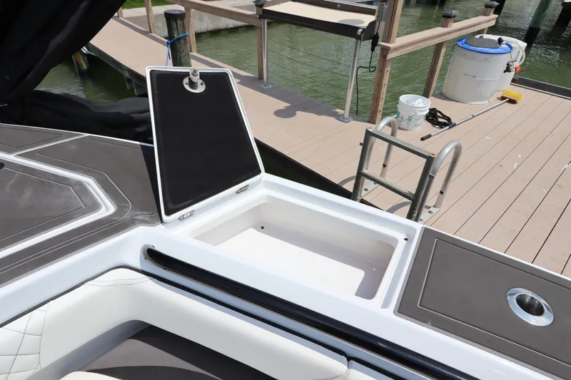  Yacht Photos Pics 2019 Statement 350 Open boat with open storage compartment at dock.