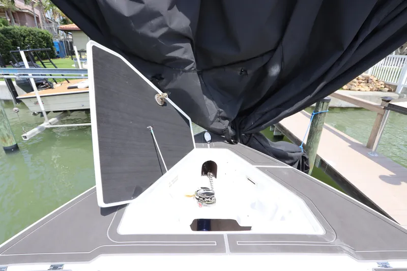  Yacht Photos Pics 2019 Statement 350 Open boat with open storage compartment at dock.