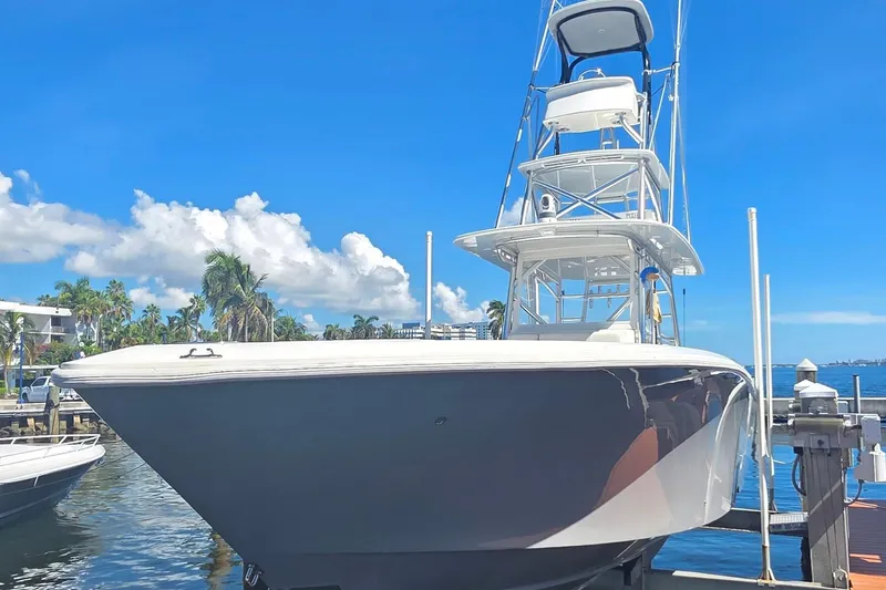 Hat Trick Yacht Photos Pics 2020 SeaVee 390Z boat docked under clear blue sky.