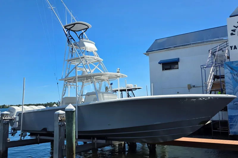 Hat Trick Yacht Photos Pics 2020 SeaVee 390Z boat docked at marina under clear blue sky.
