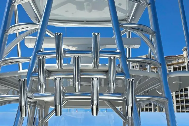 Hat Trick Yacht Photos Pics 2020 SeaVee 390Z boat tower with rod holders against a clear blue sky.