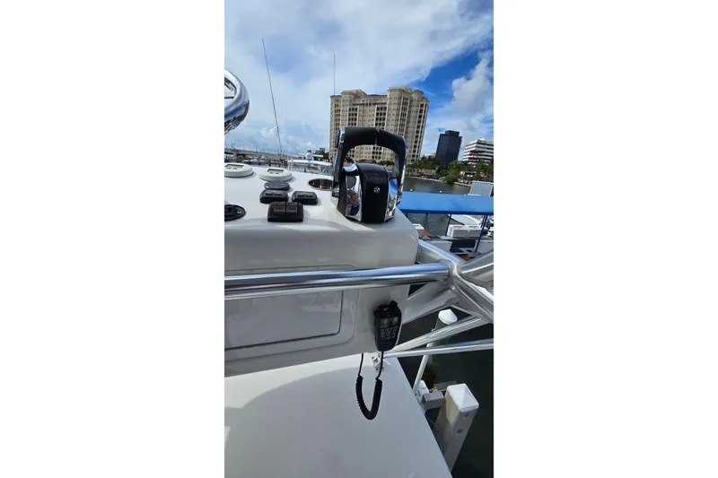 Hat Trick Yacht Photos Pics 2020 SeaVee 390Z boat dashboard with controls, cityscape in background.