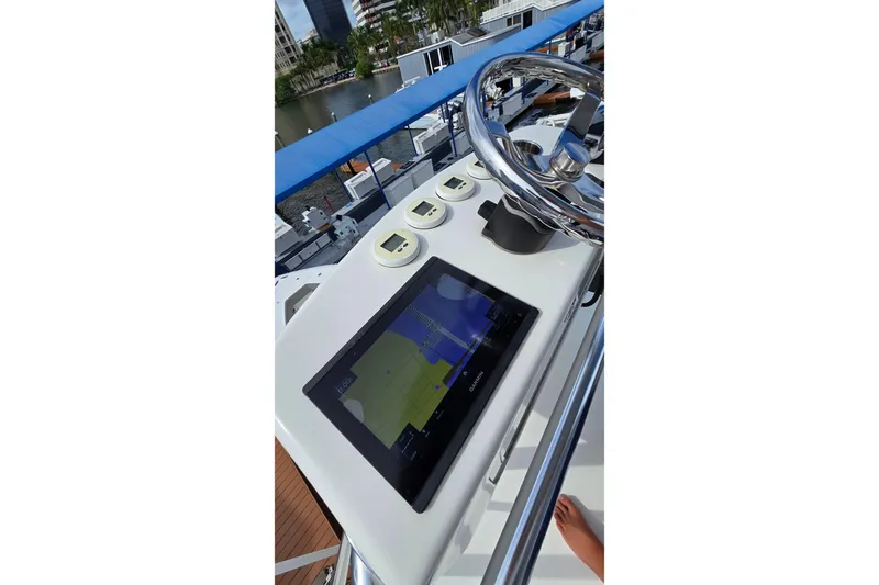 Hat Trick Yacht Photos Pics 2020 SeaVee 390Z boat helm with navigation display and steering wheel.