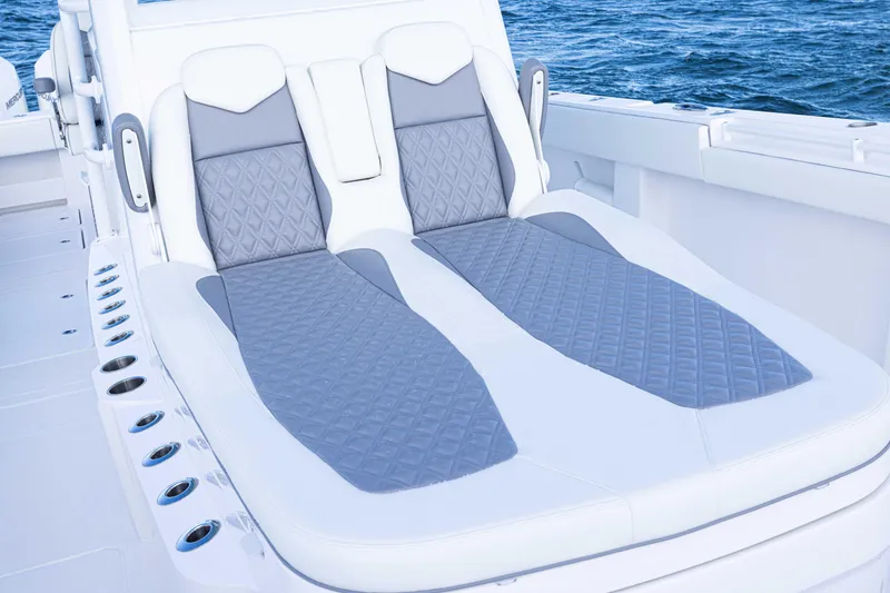  Yacht Photos Pics 2025 Invincible 35 Catamaran with luxurious seating, ocean backdrop.