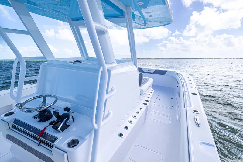  Yacht Photos Pics 2025 Invincible 35 Catamaran on open water, showcasing sleek design and modern features.