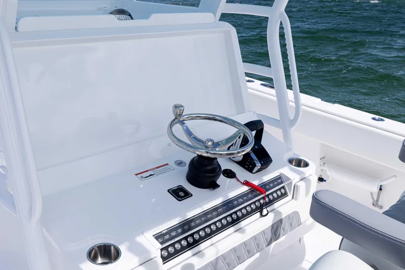  Yacht Photos Pics 2025 Invincible 35 Catamaran helm with modern steering and controls, on open water.