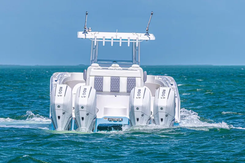  Yacht Photos Pics 2025 Invincible 35 Catamaran with quad engines cruising on open water.