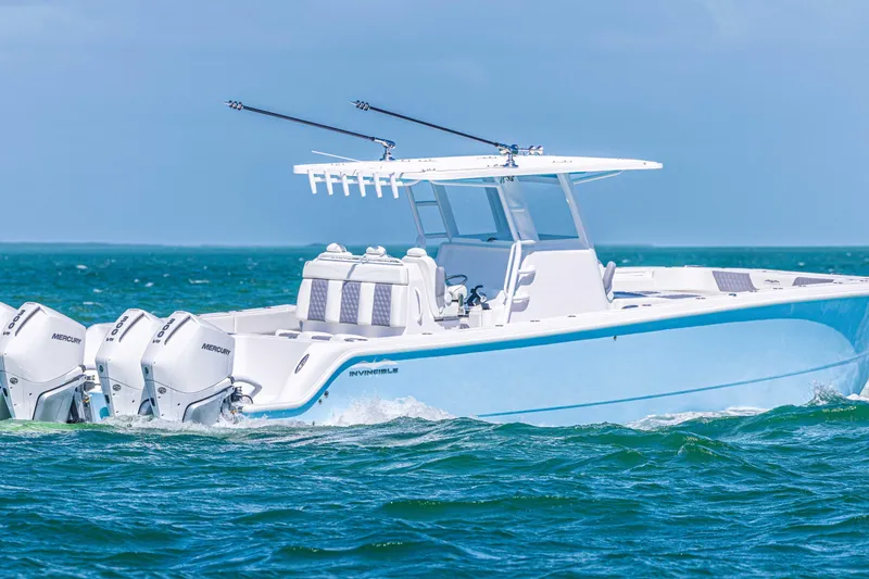  Yacht Photos Pics 2025 Invincible 35 Catamaran cruising on open water with powerful Mercury engines.