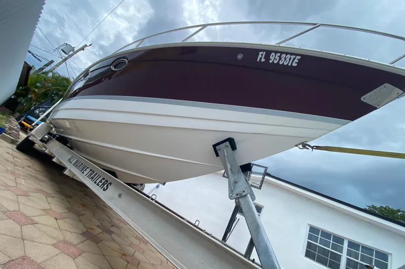  Yacht Photos Pics 2009 Formula 330 Sun Sport boat on trailer, overcast sky background.