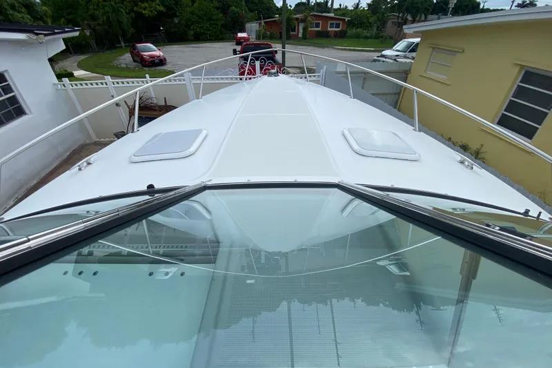  Yacht Photos Pics 2009 Formula 330 Sun Sport boat docked in residential driveway, top view.
