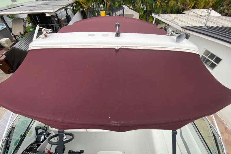  Yacht Photos Pics 2009 Formula 330 Sun Sport with maroon canopy, viewed from above.