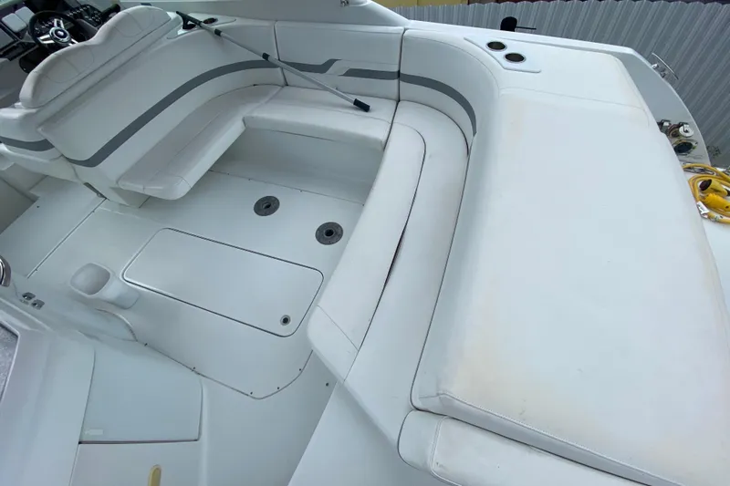  Yacht Photos Pics 2009 Formula 330 Sun Sport boat interior with white seating and storage compartments.