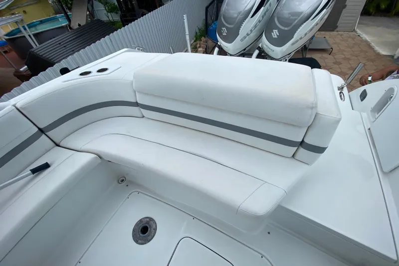  Yacht Photos Pics 2009 Formula 330 Sun Sport boat interior with white seating and cup holders.