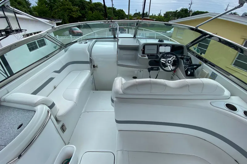  Yacht Photos Pics 2009 Formula 330 Sun Sport boat interior with white seating and modern dashboard.