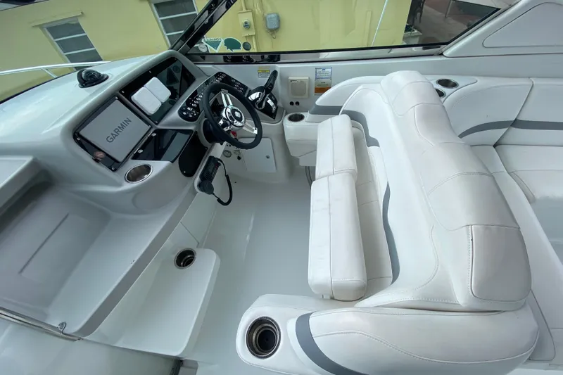  Yacht Photos Pics 2009 Formula 330 Sun Sport boat interior with Garmin navigation and white seating.