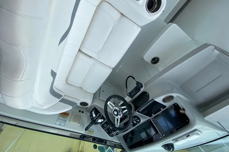  Yacht Photos Pics 2009 Formula 330 Sun Sport boat interior with white seating and modern dashboard controls.